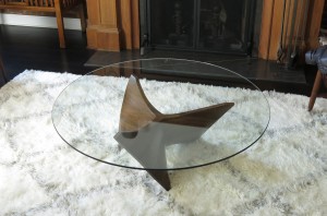 This is a photo of a sculpted wood coffee table installed