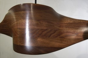This is a detail of a sculpted wood pendant lamp