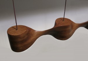 This is an overhead view of a pendant lamp made from oak, sculpted by hand