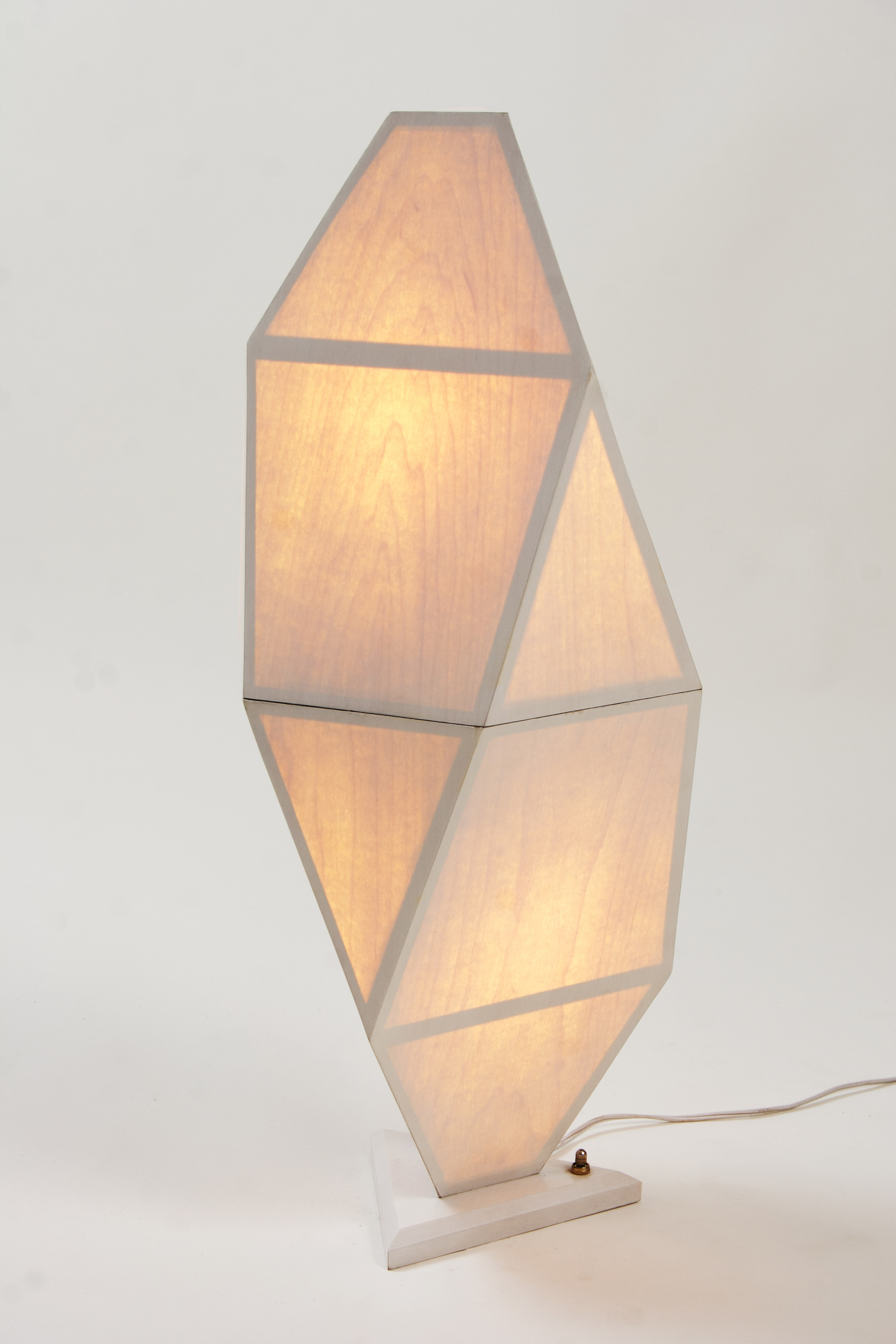Veneered geometric lamp fully lit