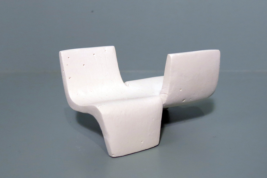 This is a photo of a plaster mockup of opposing chairs