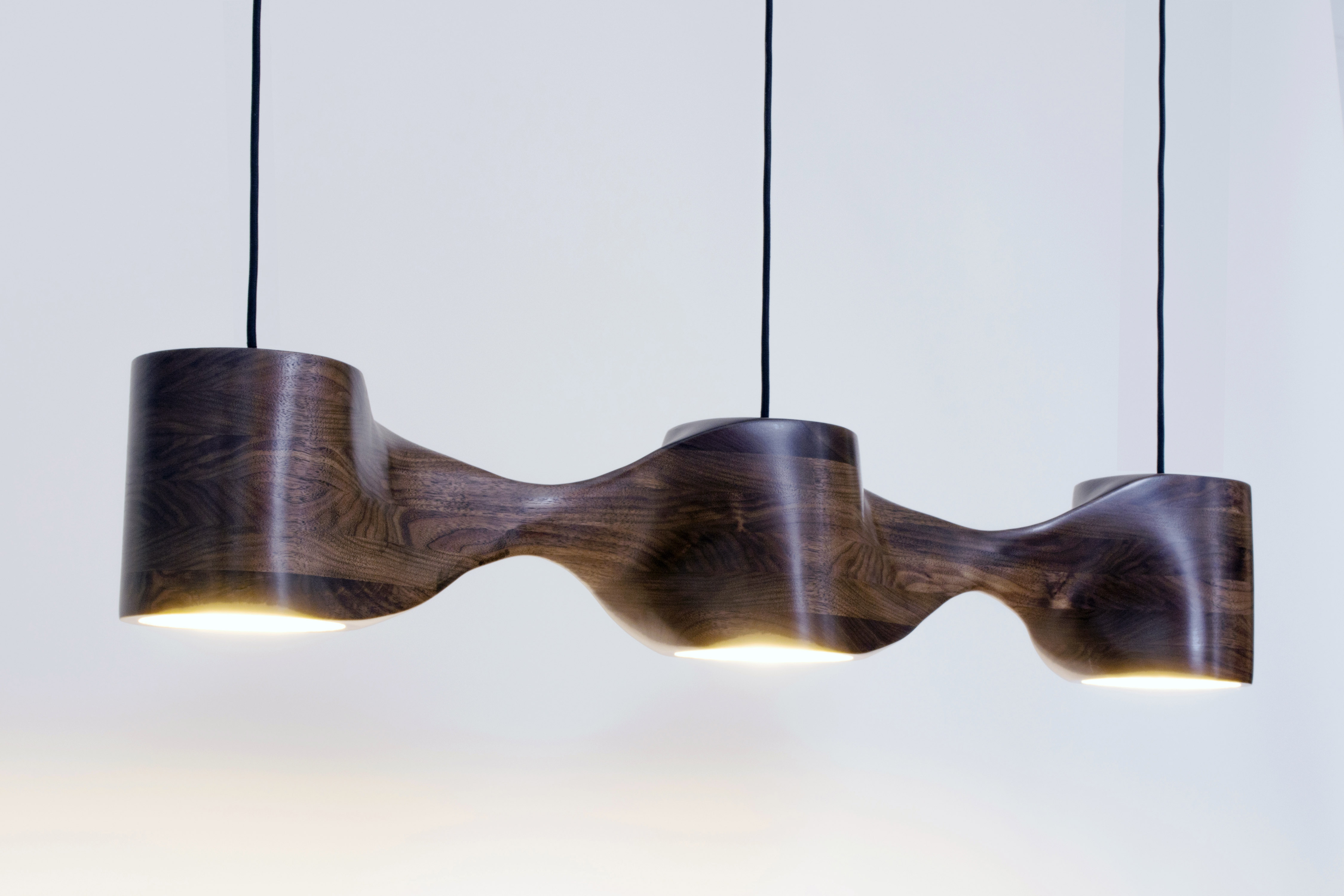 sculpted wood pendant lamp with gold leaf